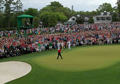 Masters champion Tiger Woods celebrates after he made his putt on hole No. 18 green to win the Masters during the final round of the Masters at Augusta National Golf Club, Sunday, April 14, 2019.